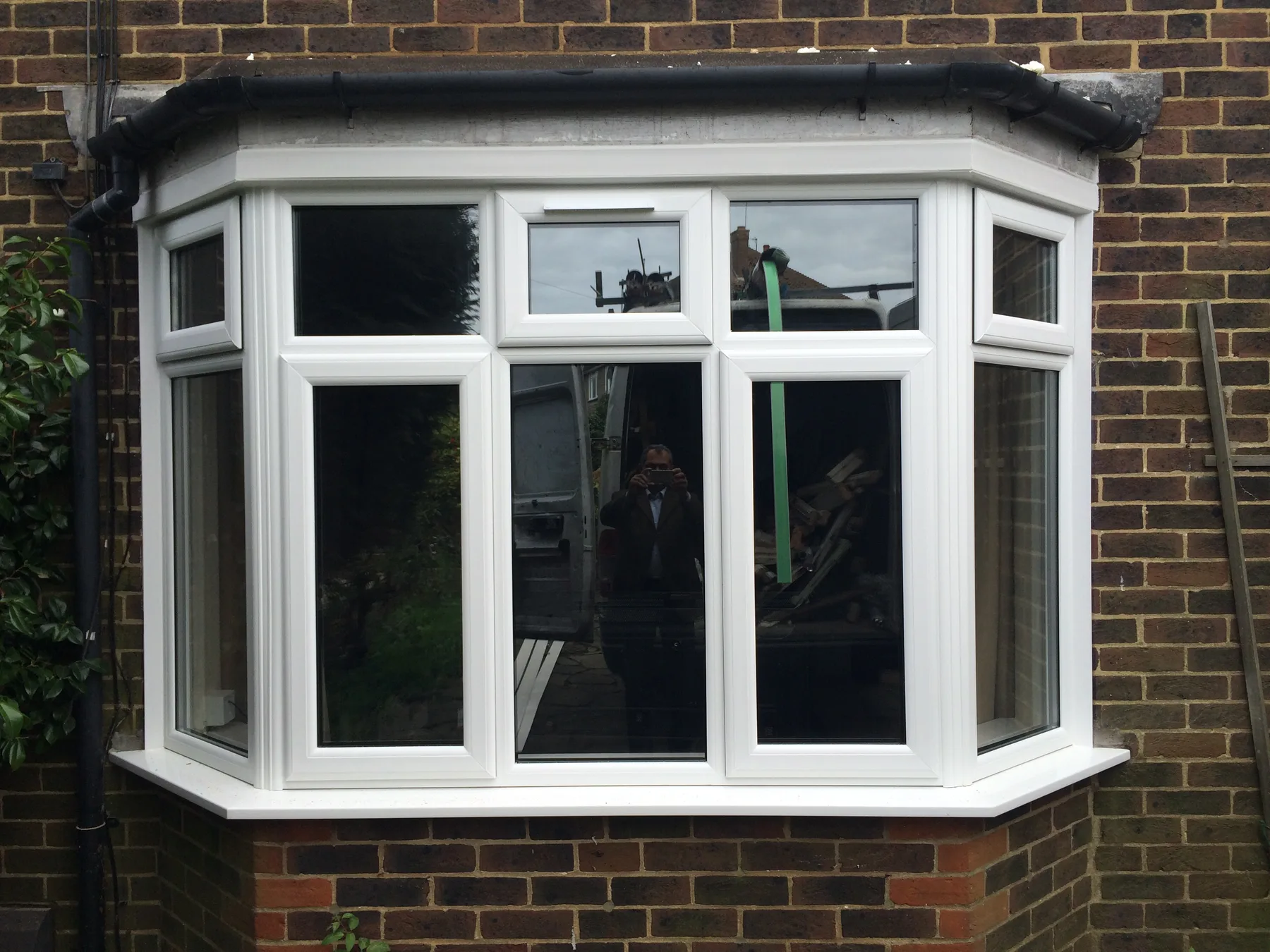 White bay window on brick