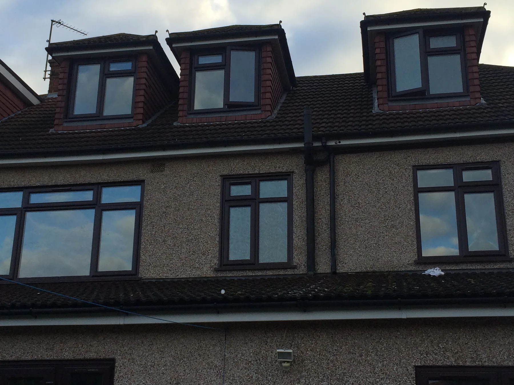 Anthracite casements across a terrace