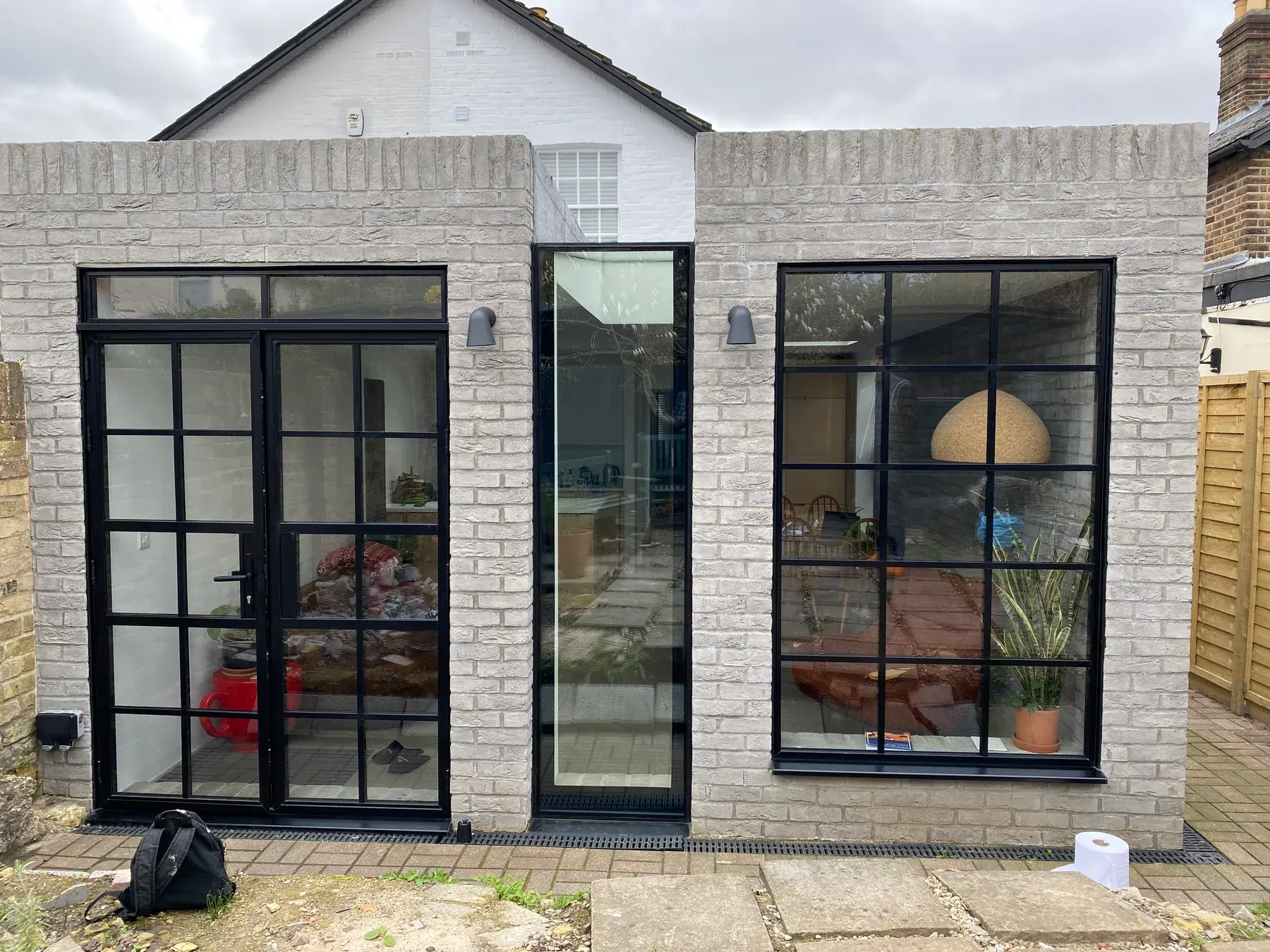 Crittall door & window · painted brick