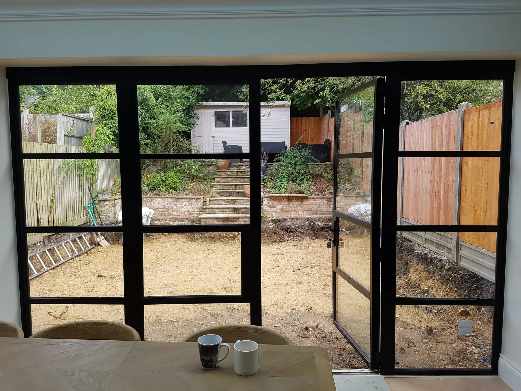 Full-width Crittall screen · garden room