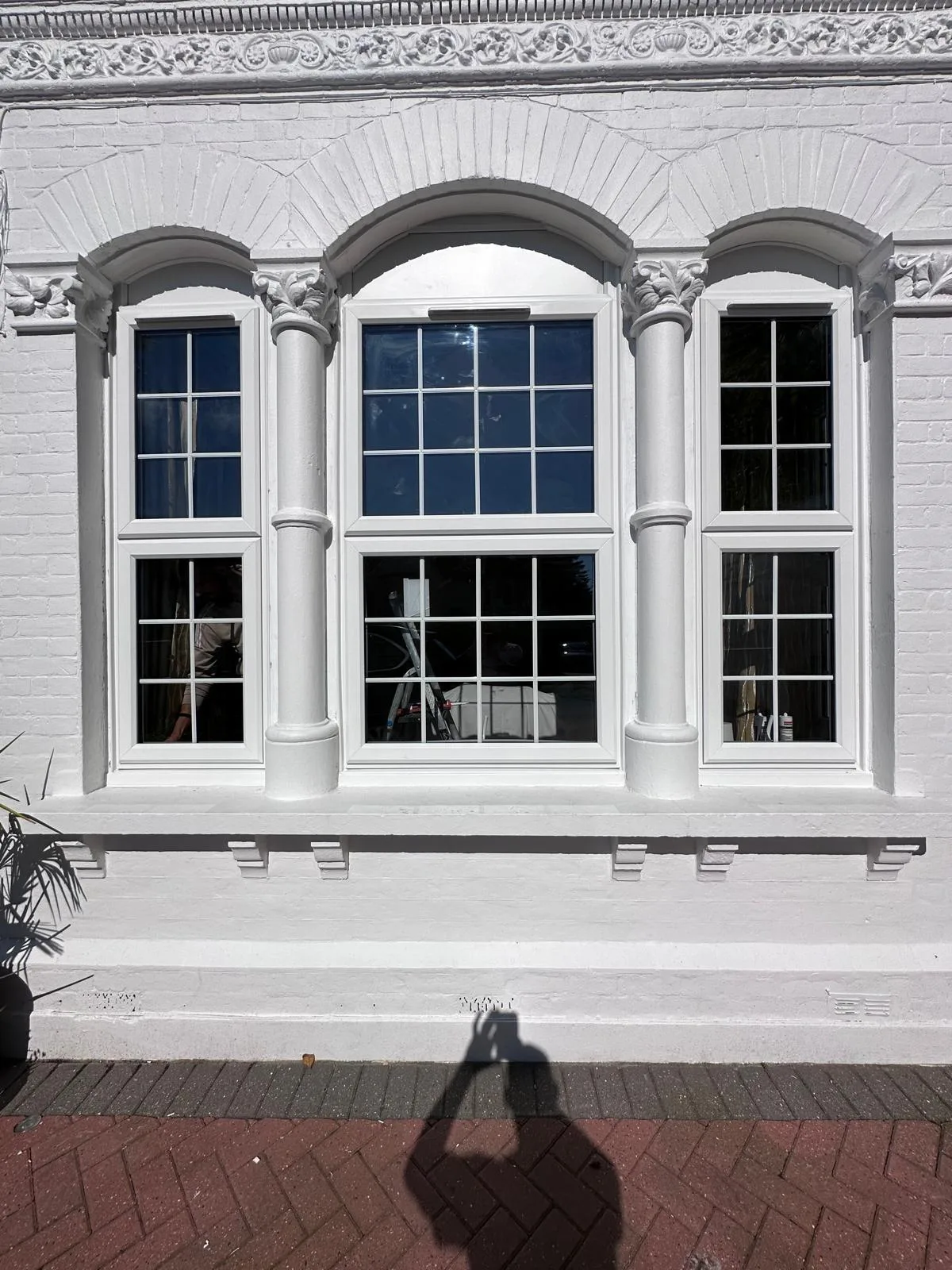 Heritage sash in a carved stone surround