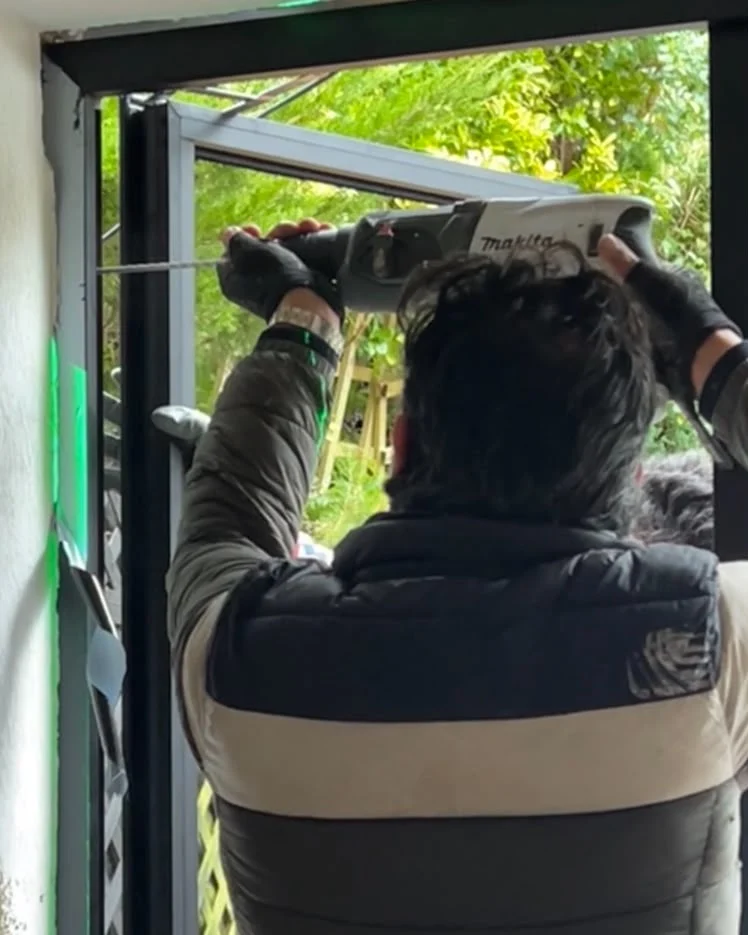One of our installers fitting an aluminium window frame
