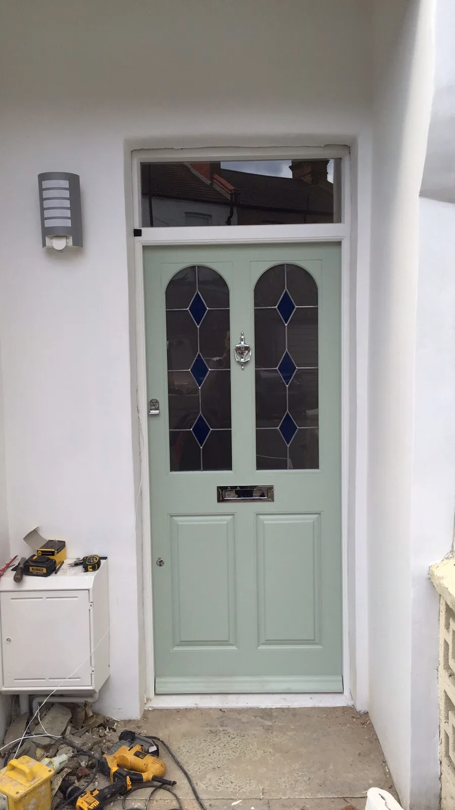 Sage green composite door with leaded glass